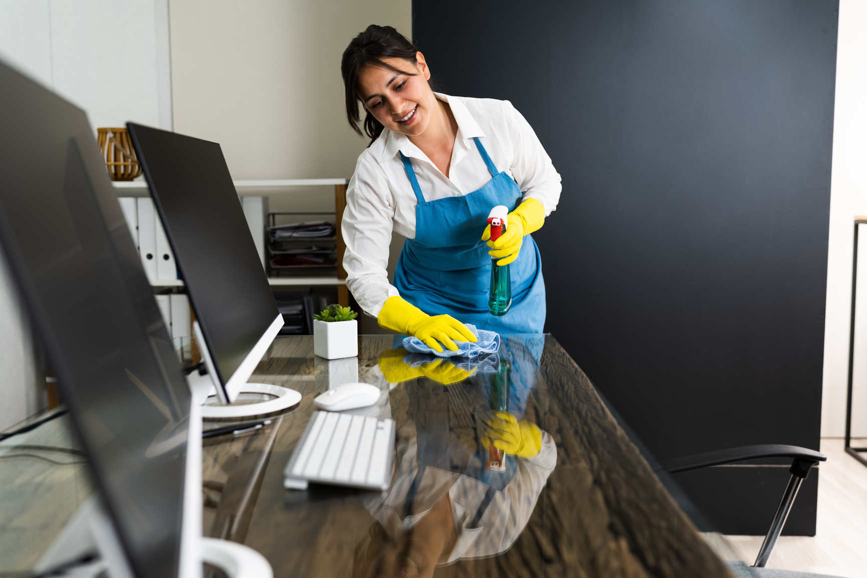 Janitor Cleaning Office Desk